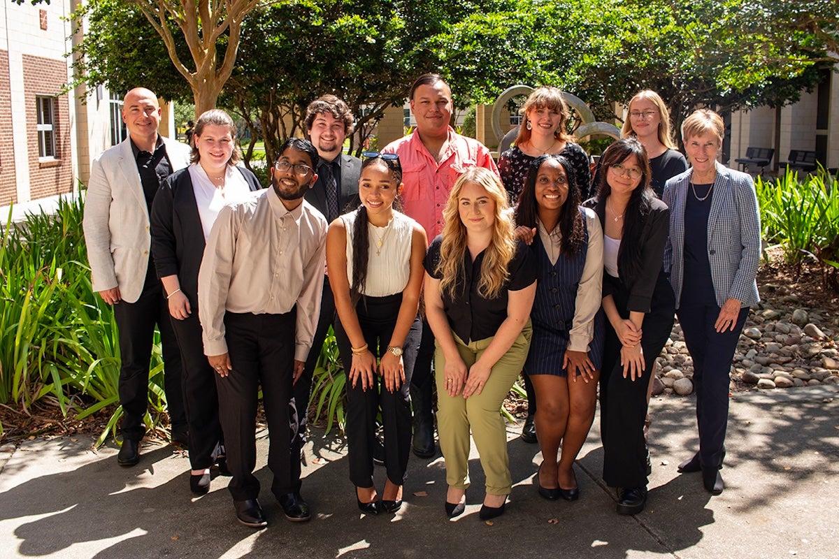 A group of students and faculty posing for a photo.