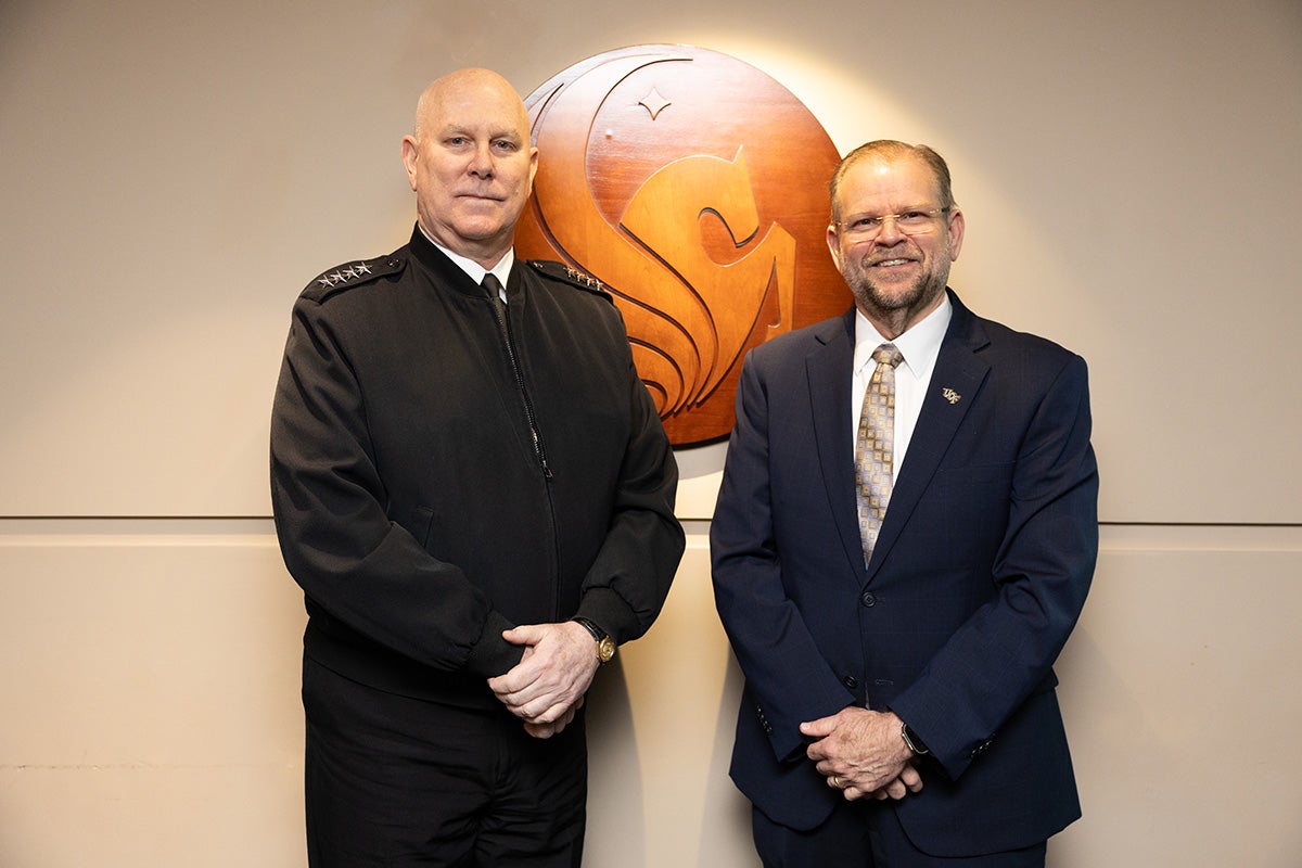 Admiral Christopher Grady, vice chairman of the Joint Chiefs of Staff, and UCF President Alexander N. Cartwright