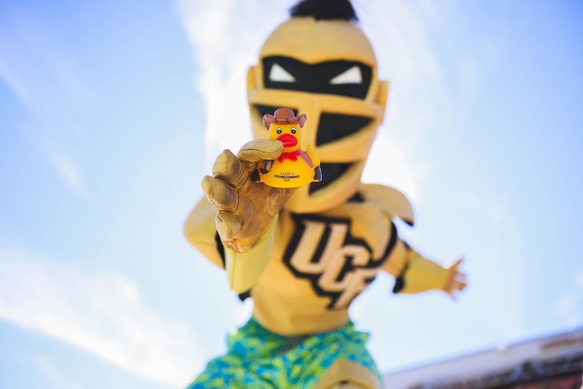 Knightro holding a cowboy-themed Spirit Splash duck