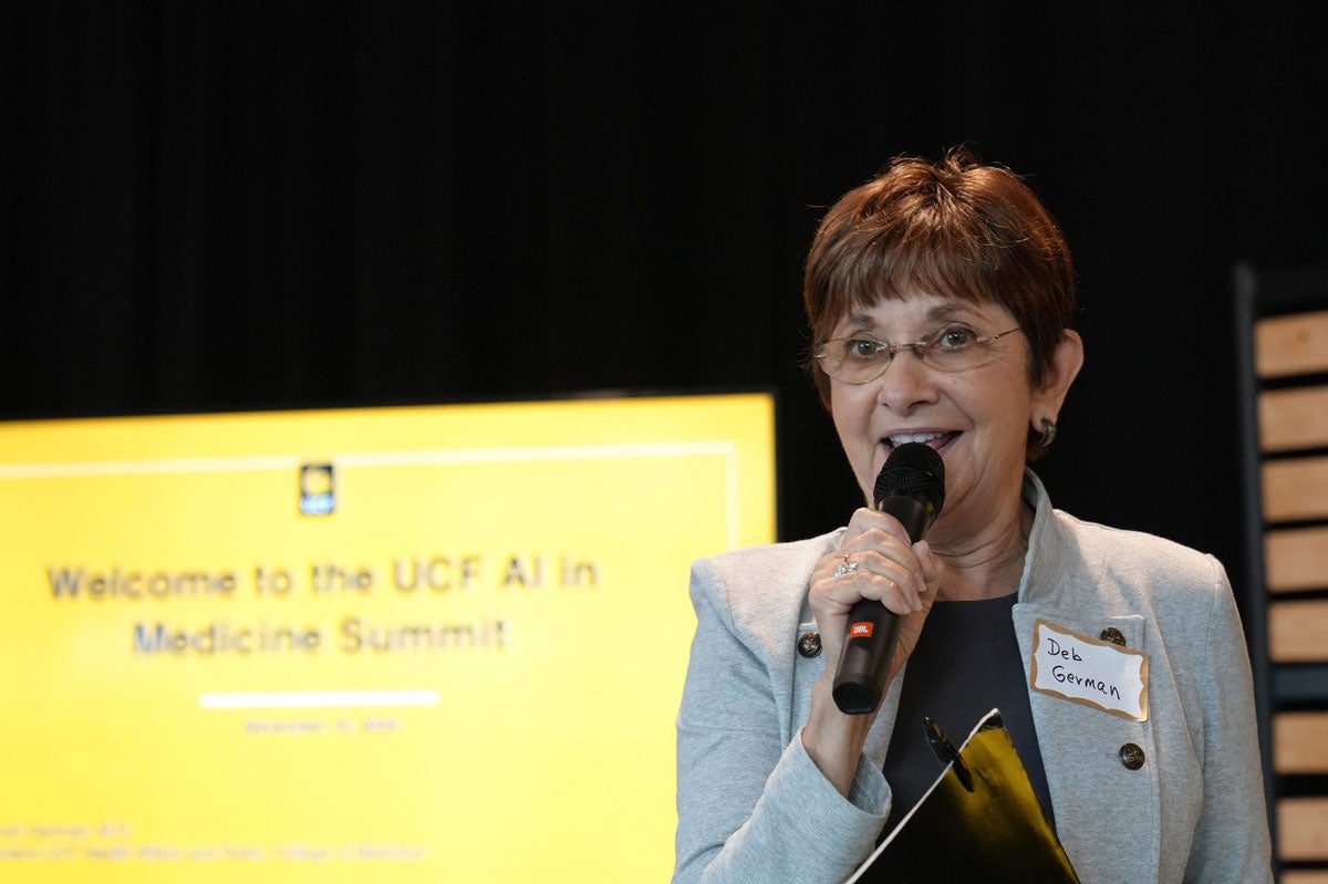 A woman speaking into a microphone