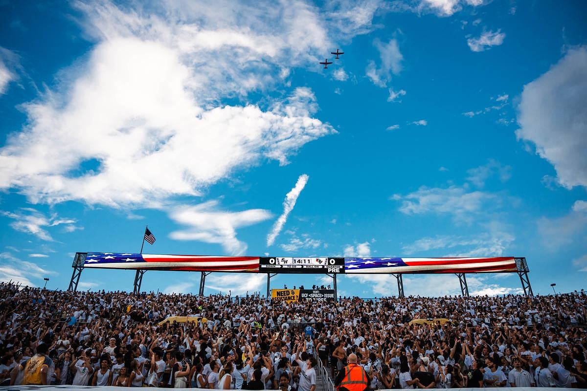 Two fighter jets fly over a crowd of fans in FBC Mortgage Stadium during the UCF versus Sam Houston football game