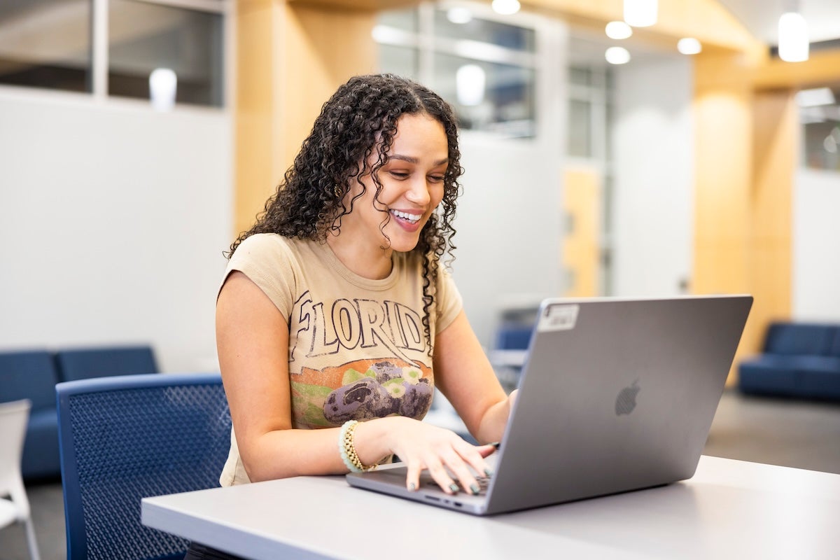 A student working on a laptop