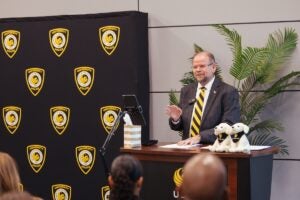 UCF President Alexander N. Cartwright speaks to the audience at the UCF Police Department's swearing-in ceremony.