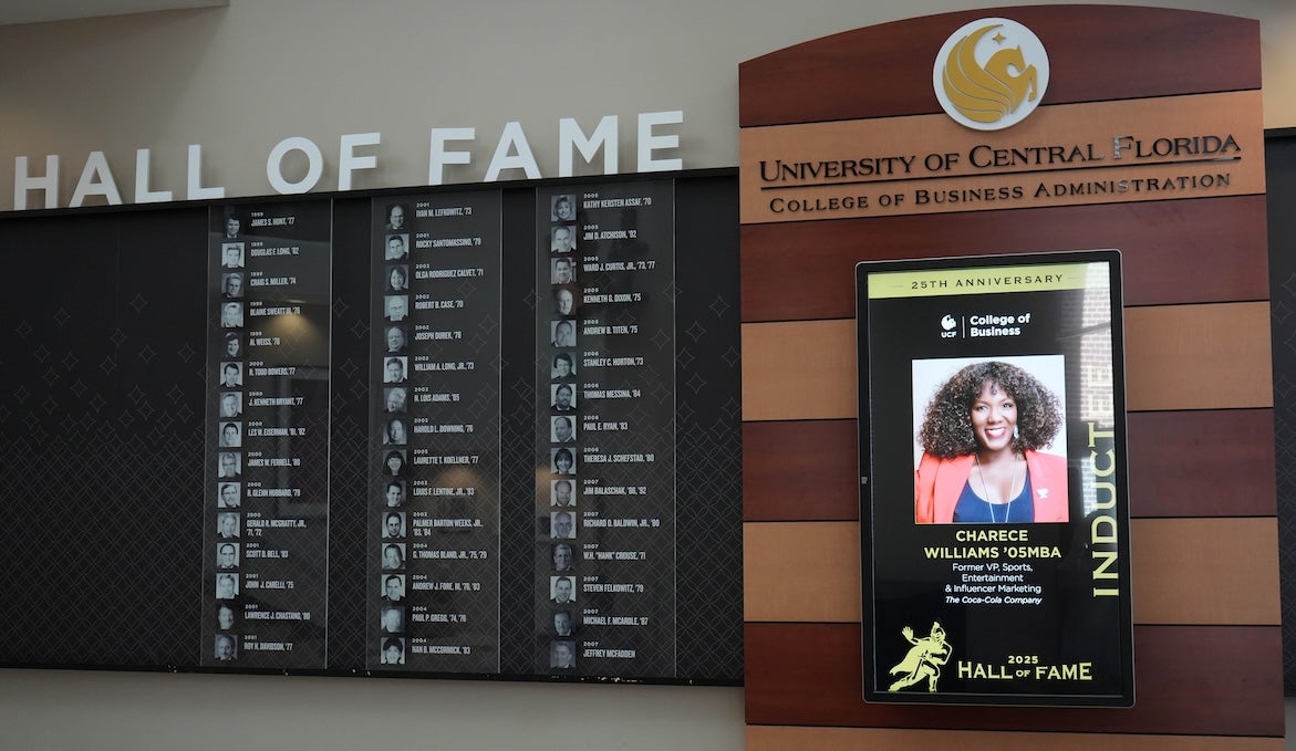 The UCF College of Business Hall of Fame display lists names of former honorees