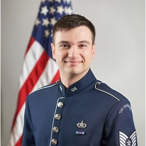 Christopher Baird, a UCF percussion alum, poses for a photo