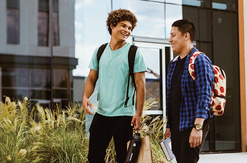 Two students walking and talking