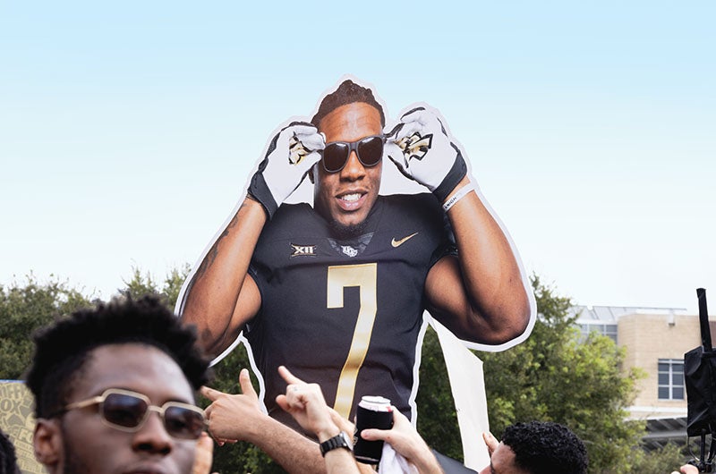 A sign of UCF football player RJ Harvey wearing sunglasses